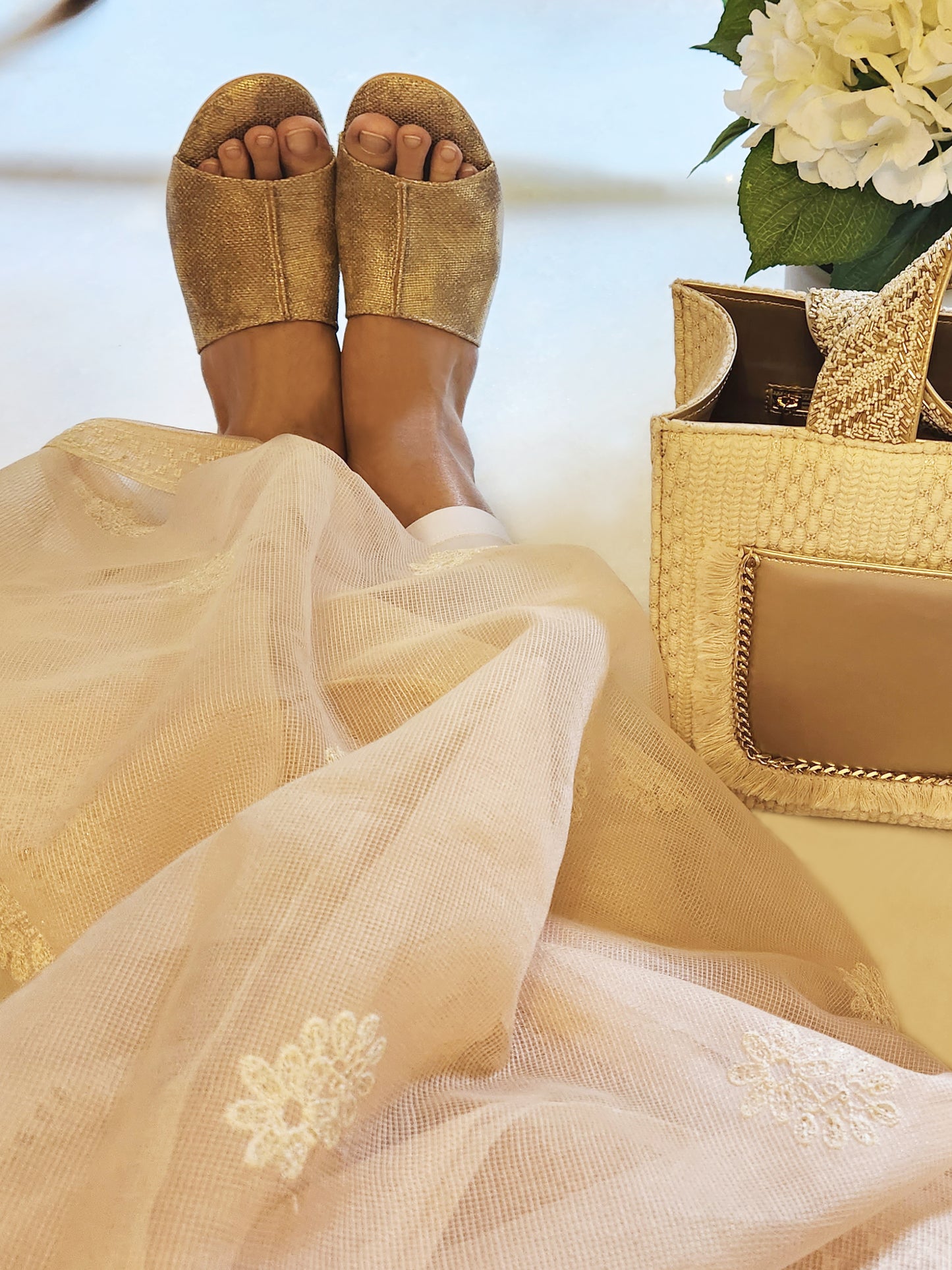 Gold wedding heels on feet